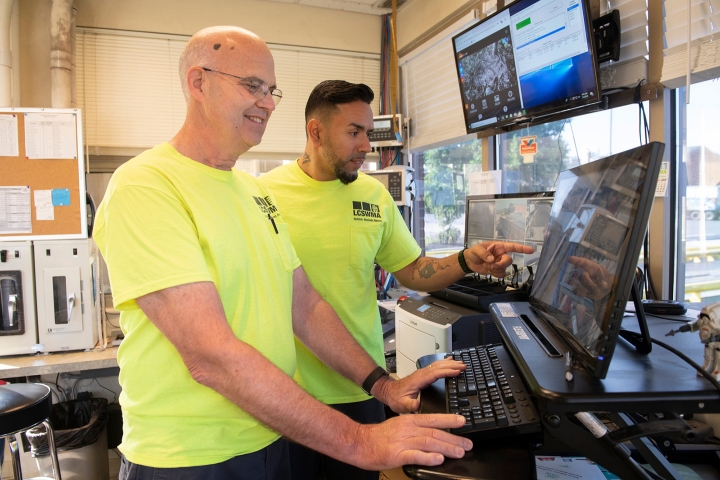 2 men working at the LCSWMA Transfer Station Complex