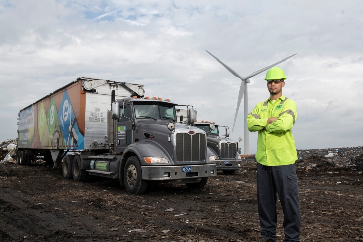 A LCSWMA worker standing in front of a truck at the Frey Farm Landfill