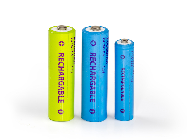 Blue rechargeable nickel metal hydride batteries AA and AAA sizes with designation of the different their parameters on a white surface
